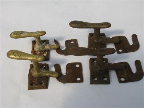 lot of old antique architectural casement window or shutter latches, brass and iron