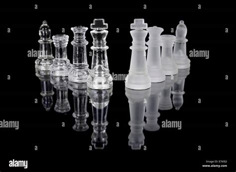 Chess pieces isolated on black background. Beautiful reflection composition Stock Photo - Alamy