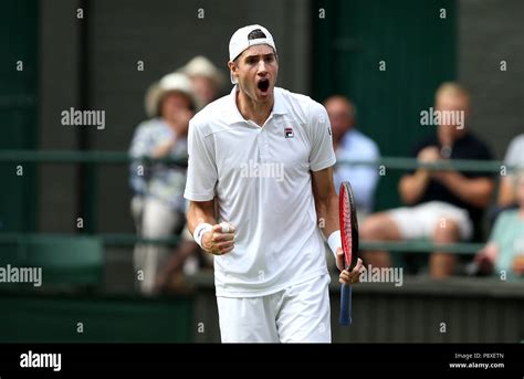 John Isner celebrates on day eleven of the Wimbledon Championships at ...