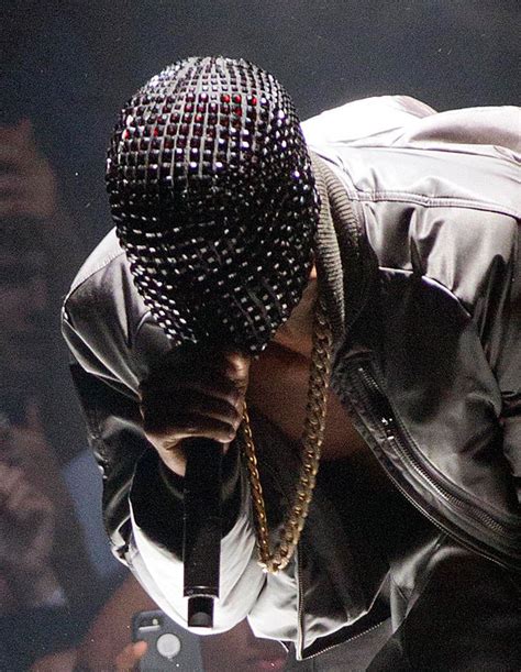 Feeling camera shy? Kanye West dons bizarre studded mask for new tour ...