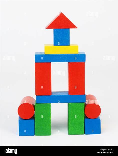 Multicoloured building blocks in the shape of a tower Stock Photo - Alamy