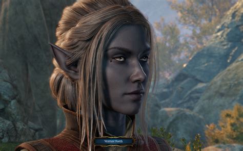 a close up of a person with long hair and an elf costume in the background