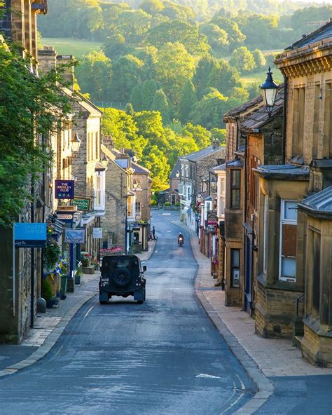 Green rolling hills seen from the High Street in Pateley Bridge, a small market town in ...