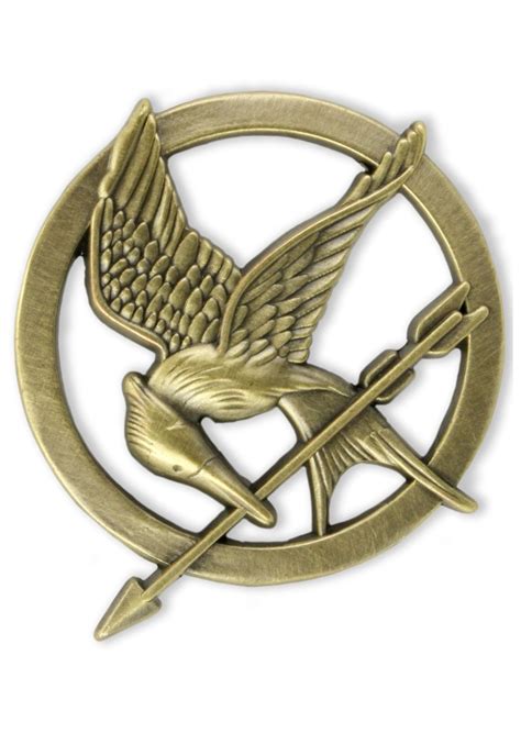 This gold mockingjay pin was given to Katniss by Madge, the mayors ...