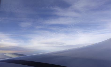 Airplane in a Purple Sky with Clouds · Free Stock Photo