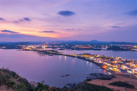 Premium Photo | Sunset at jeju do seongsan ilchulbong , jeju island at night, south korea