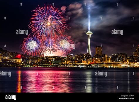 Lake Union 4th of July Fireworks and the Seattle skyline, as seen from across Elliott Bay at ...