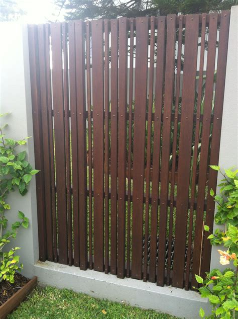 Front Fence - love the look of these wooden slats.