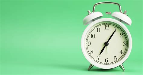 Alarm clock isolated on a green background, Showtime 07.00 am or pm ...