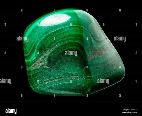 Polished malachite (cu2co3(oh)2) stone isolated on black background Stock Photo - Alamy