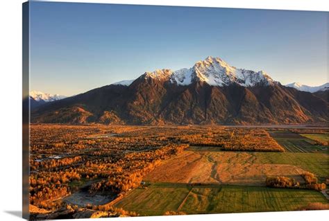 Sunset on Pioneer Peak and farm fields near Palmer, Alaska during ...