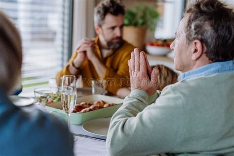 Close-up of Family Praying before Easter Lunch. Stock Photo - Image of traditional, together ...