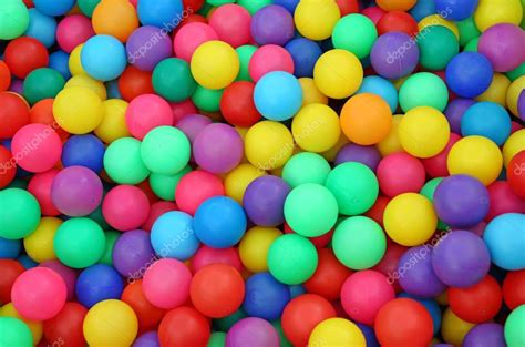 Many colorful plastic balls in a kids' ballpit at a playground. — Stock ...