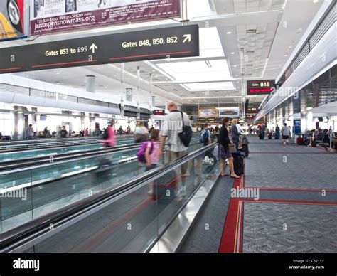 Airport Travelers, Moving Sidewalks and Gates, United Terminal, Denver International Airport, CO ...