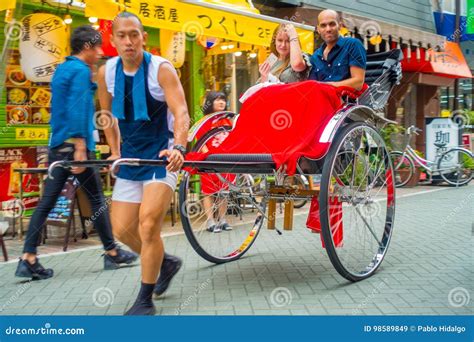 TOKYO, JAPAN JUNE 28 - 2017: Tourists Rides a Rickshaw at Sensoji ...