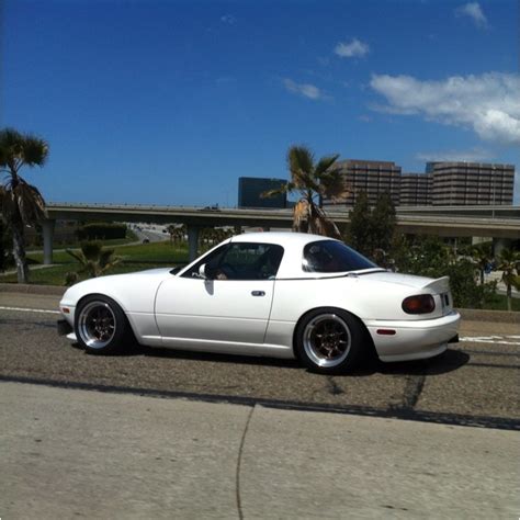 Miata w the hardtop. This thing was all caged out ready for the track ...