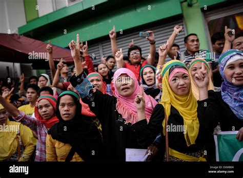 Manila, Philippines. 27th Mar, 2014. Filipino Muslim women shout slogans during celebrations at ...