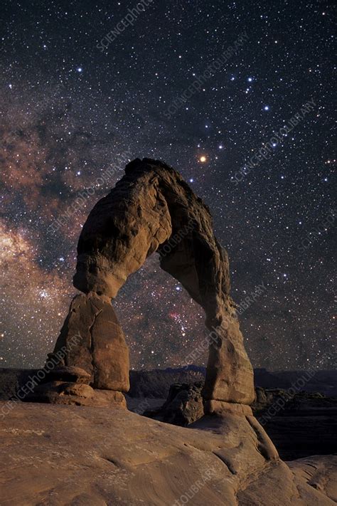 Night sky through Delicate Arch, Utah - Stock Image - R550/0483 - Science Photo Library