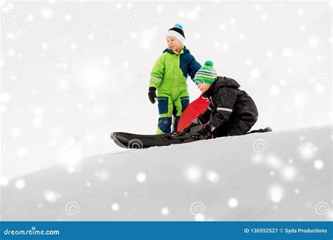 Kids Sliding on Sleds Down Snow Hill in Winter Stock Image - Image of ...