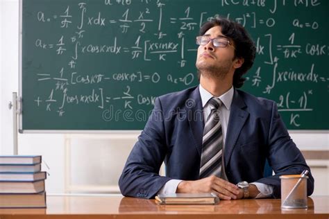 The Young Male Math Teacher in Classroom Stock Image - Image of board, mathematician: 141785617