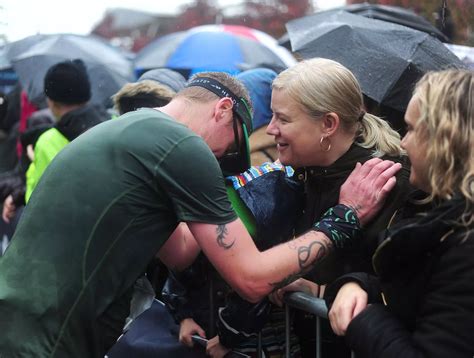 Manchester Half Marathon in pictures: Runners brave the torrential rain to complete route ...