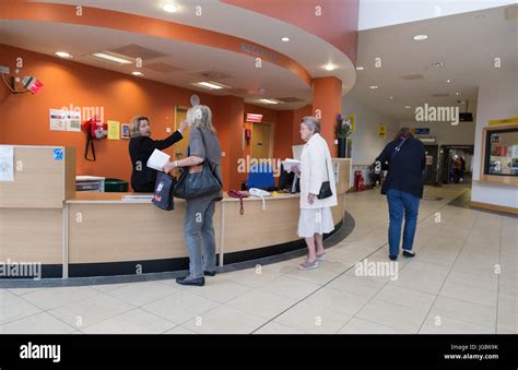 Hospital Reception - patients at the West Wing Reception desk, John Radcliffe Hospital Oxford ...