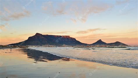 Premium Photo | Landscape with beach and table mountain at sunrise