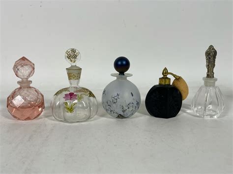 Collection Of Perfume Bottles (Right Bottle Has Sterling Top)