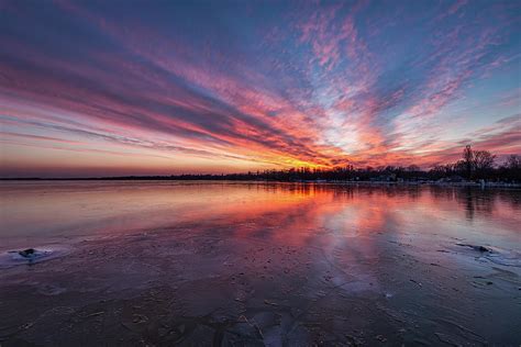 Beautiful sunset light in winter over lake Balaton of Hungary Photograph by Arpad Radoczy - Pixels