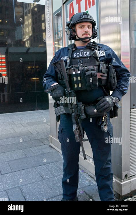 An armed NYPD counterterrorism policeman on patrol in Times Square in ...