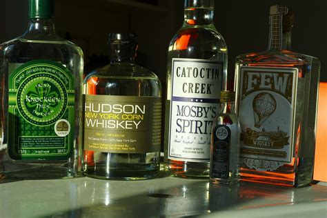 several bottles of alcohol are lined up on a counter