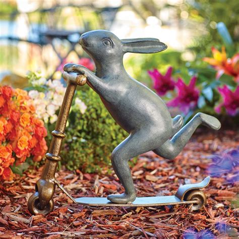 This bunny garden statue is hoppy to share her upbeat attitude. She ...