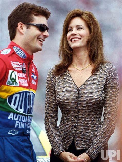 Photo: Jeff Gordon and his wife Brooke share a lighter moment just prior to the NASCAR UAW-GM ...