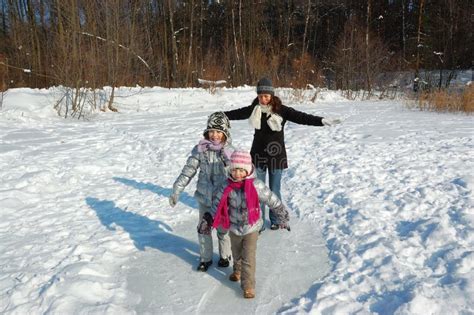 Happy Family in Winter, Having Fun and Playing with Snow Outdoors on ...