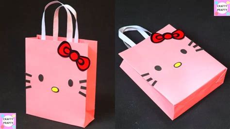 two pink bags with hello kitty faces on them