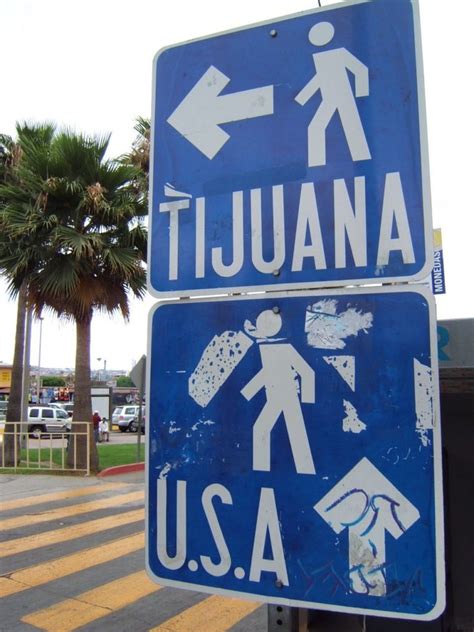 Pedestrian_border_crossing_sign_Tijuana_Mexico