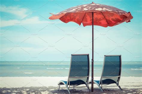 Beach chair and umbrella | Stock Photos ~ Creative Market