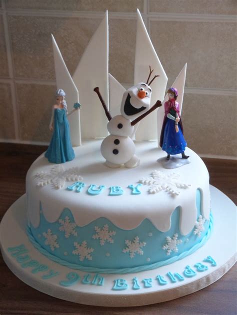 Frozen themed cake with a hand made Olaf | Frozen birthday cake, Frozen birthday party cake ...