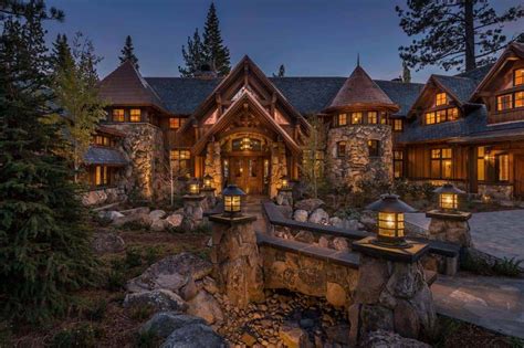 a large house surrounded by trees and rocks