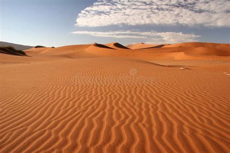 Sossusvlei dunes. Red dunes against blue clear sky with cloudscape ...