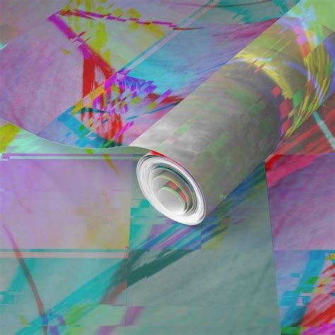 a roll of paper that is laying on top of a surface with multicolored ...