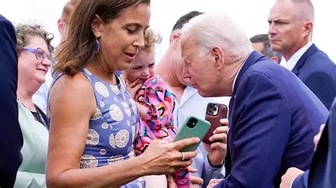 Watch: Joe Biden seen nibbling on ‘frightened’ child's shoulder in Finland | World News ...