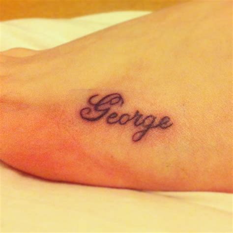 This is my 2nd tattoo and is placed on my foot, "George" is the name of ...