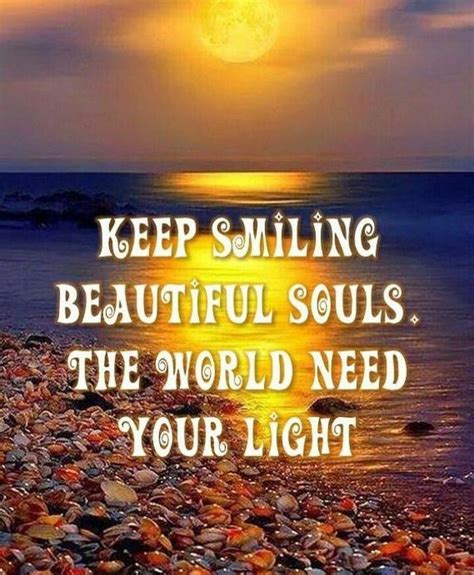 a quote on the beach that says keep smiling beautiful souls the world need your light