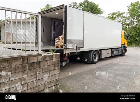 Parcel delivery truck loading or offloading at loading bay Stock Photo: 163618487 - Alamy