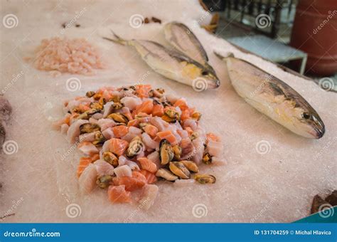 Fresh Raw Shrimps, Pieces of Salmon, Mussels on the Ice on the Traditional Street Market of ...