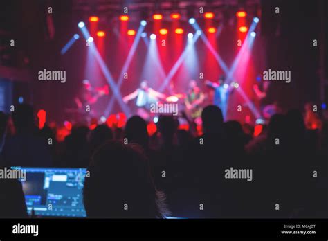 The audience watching the concert on stage Stock Photo - Alamy