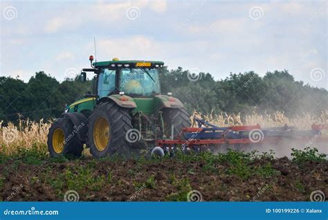 Tractor Harrowing the Field Editorial Photo - Image of industry, arable: 100199226