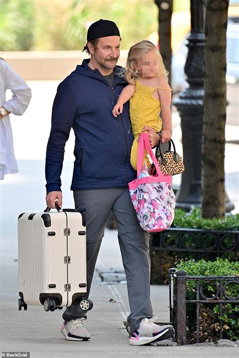 Bradley Cooper holds his daughter Lea in NYC - WSTale.com