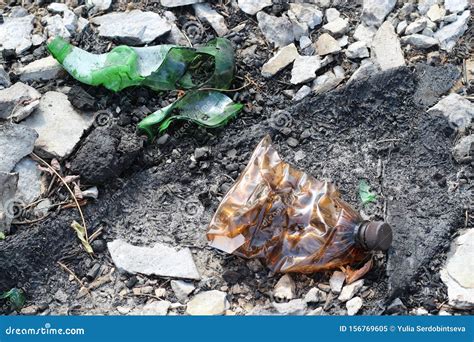 Plastic and Glass Bottles in the Landfill during Decomposition. the Concept of Environmental ...